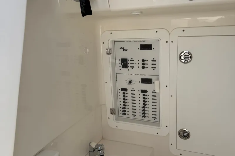  Yacht Photos Pics 2024 SeaVee 32Z control panel with switches and dials in a white interior.