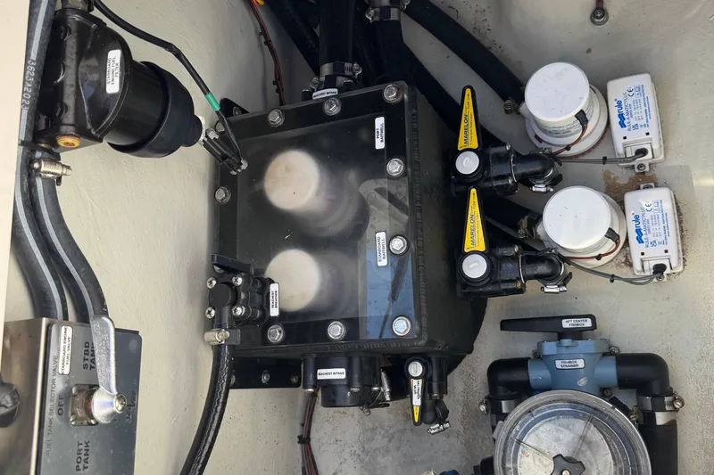  Yacht Photos Pics 2024 SeaVee 32Z boat engine compartment with pumps and valves.