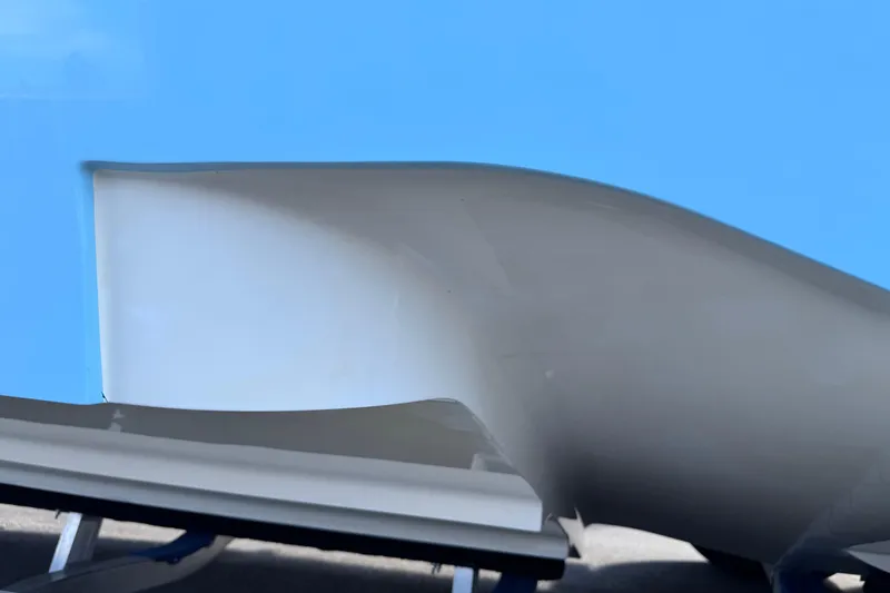  Yacht Photos Pics 2024 SeaVee 32Z boat hull detail against a clear blue sky.