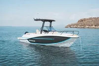 2026 Quicksilver 705 Open boat on calm water, near rocky shoreline.