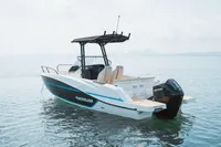 2026 Quicksilver 705 Open boat on calm water, featuring sleek design and Mercury engine.