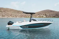 2026 Quicksilver 705 Open boat on calm water with scenic hillside background.