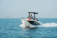 2026 Quicksilver 705 Open boat cruising on open water with passengers.