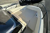 2026 Quicksilver 705 Open boat with spacious sunbathing area and sleek design.