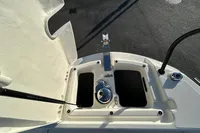 2026 Quicksilver 705 Open boat deck with storage compartments and chrome fittings.