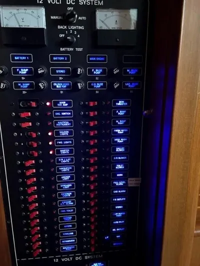 Kairos Yacht Photos Pics Control panel of a 2005 Selene 36 yacht's 12-volt DC system with illuminated switches.