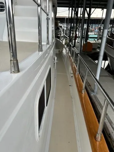 Kairos Yacht Photos Pics 2005 Selene 36 yacht side deck with railing in marina.