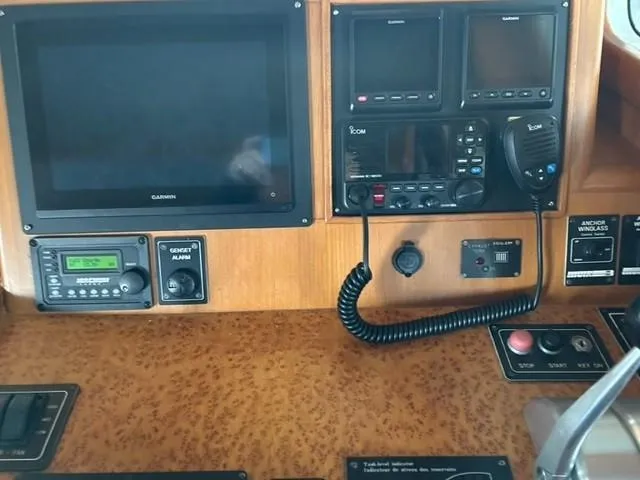 Kairos Yacht Photos Pics Control panel of a 2005 Selene 36 yacht with navigation and communication equipment.