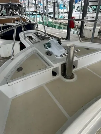 Kairos Yacht Photos Pics 2005 Selene 36 boat deck with railing and winch in marina.