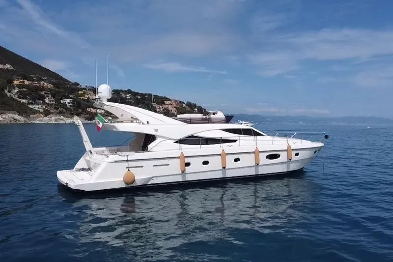  Yacht Photos Pics 2004 Ferretti Yachts 620 on calm sea with coastal backdrop.