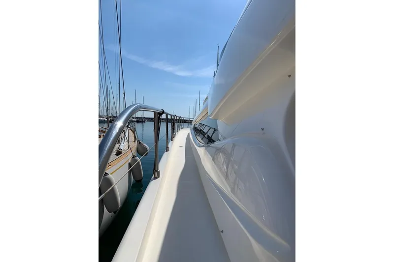  Yacht Photos Pics Side view of a 2004 Ferretti Yachts 620 docked at a marina.