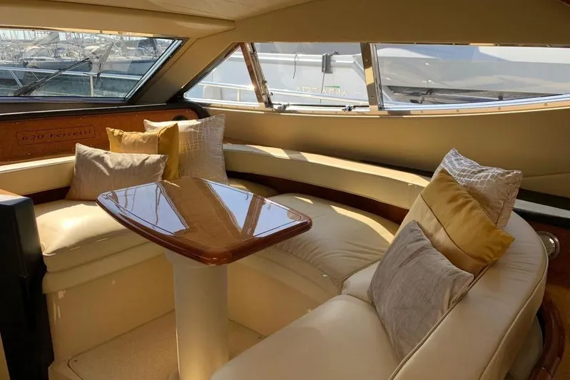  Yacht Photos Pics Luxurious interior of 2004 Ferretti Yachts 620 with plush seating and elegant table.