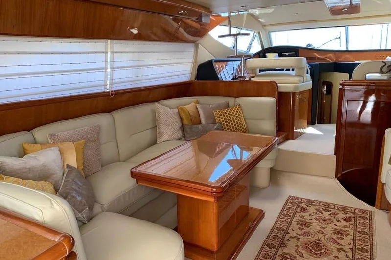  Yacht Photos Pics Luxurious interior of 2004 Ferretti Yachts 620 with elegant seating and wooden finishes.
