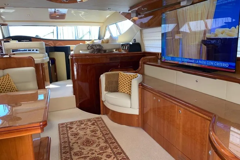  Yacht Photos Pics Luxurious interior of a 2004 Ferretti Yachts 620 with elegant wood finishes and modern amenities.