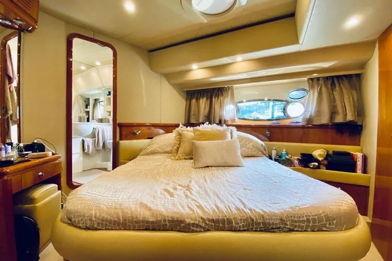  Yacht Photos Pics Luxurious bedroom interior of 2004 Ferretti Yachts 620 with elegant decor and ample natural light.