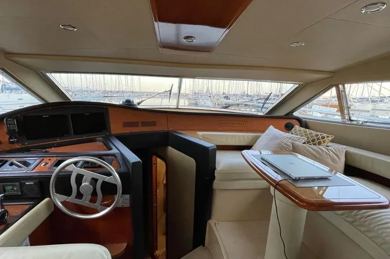  Yacht Photos Pics Luxurious interior of a 2004 Ferretti Yachts 620 with helm and seating area.