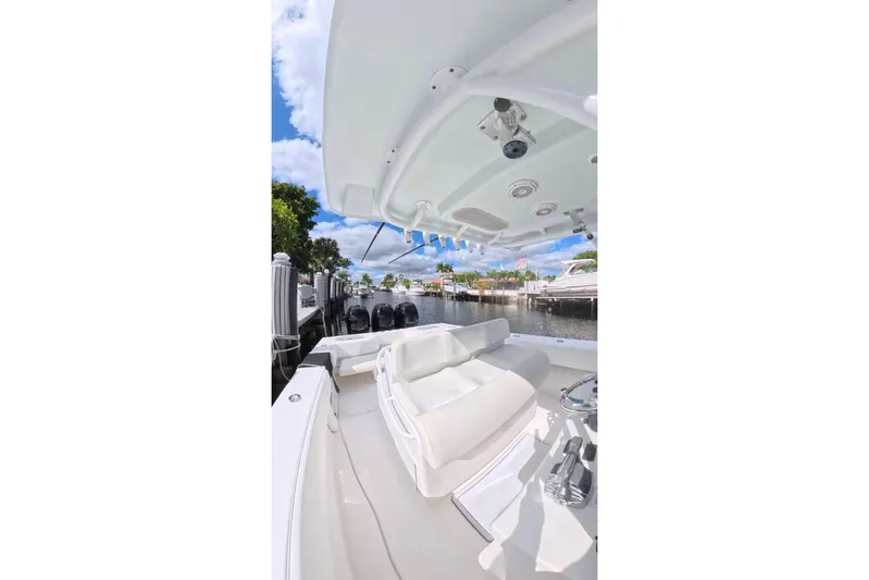  Yacht Photos Pics 2010 SeaHunter 40 boat interior with seating, docked by a scenic waterfront.