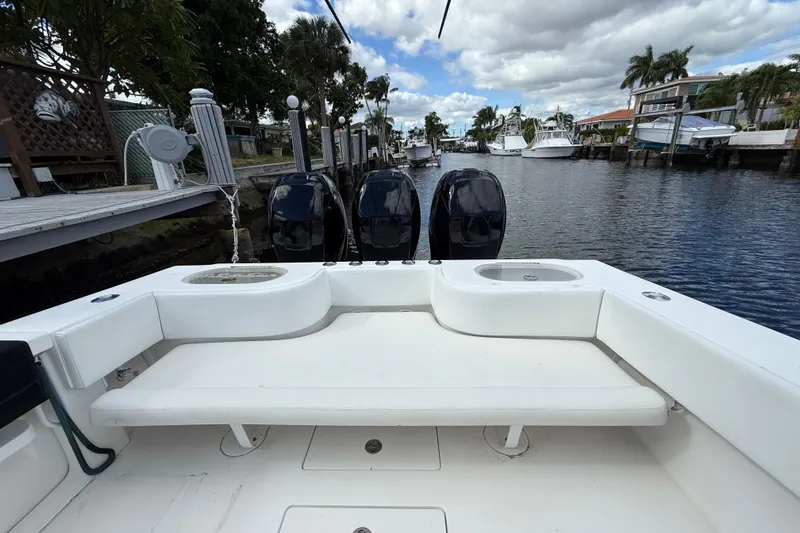  Yacht Photos Pics 2010 SeaHunter 40 boat with triple engines docked in a scenic canal.