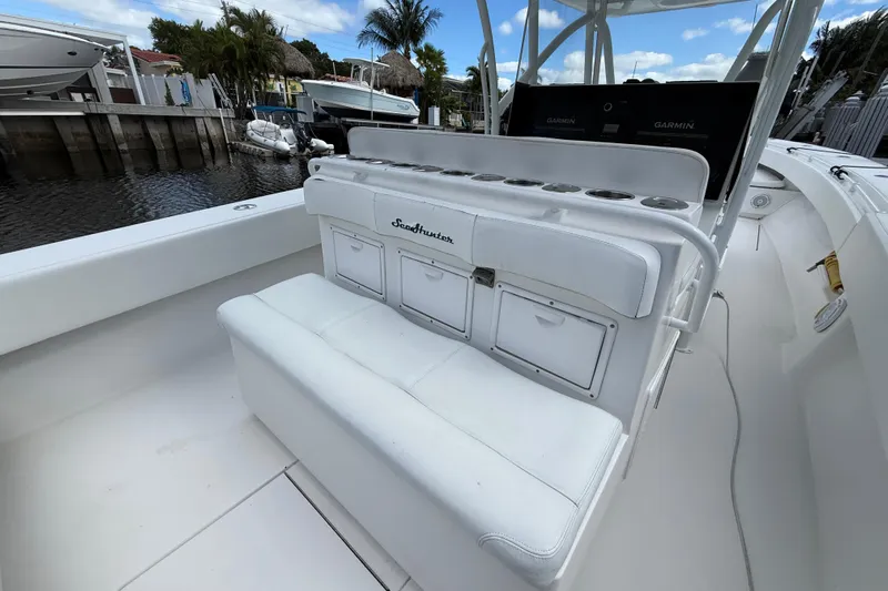  Yacht Photos Pics 2010 SeaHunter 40 boat interior with white seating and storage compartments.