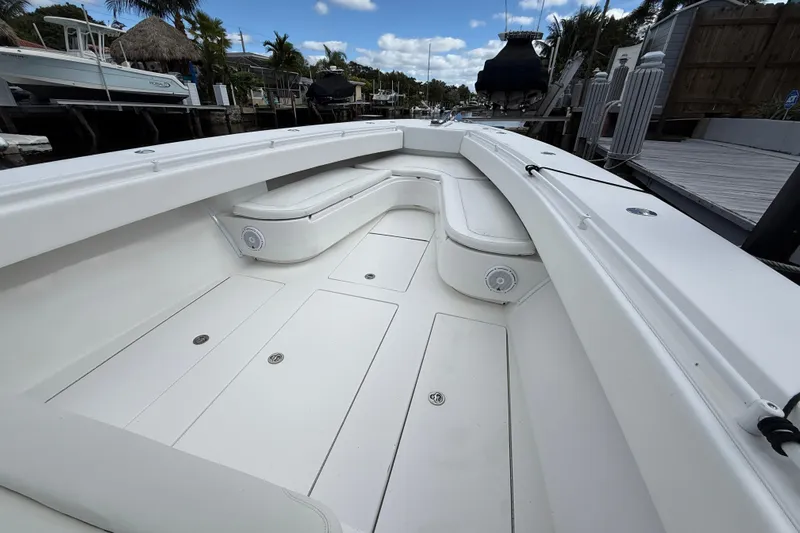  Yacht Photos Pics 2010 SeaHunter 40 boat interior with white seating and storage compartments.