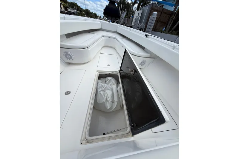 Yacht Photos Pics 2010 SeaHunter 40 boat interior with open storage compartment and cushioned seating.