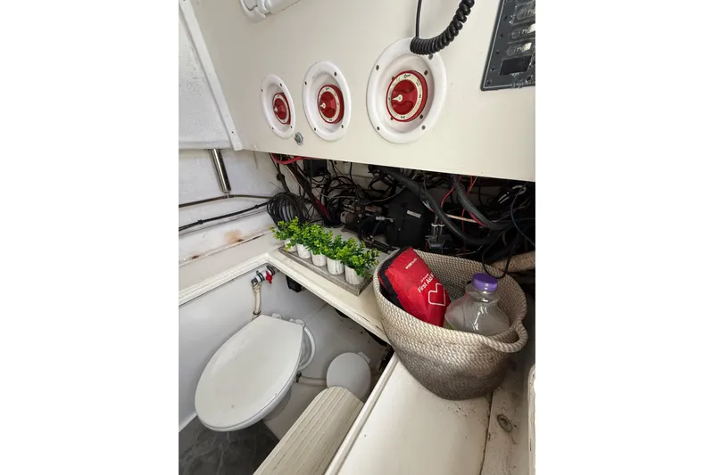  Yacht Photos Pics Interior of 2010 SeaHunter 40 boat with toilet, plants, and storage basket.