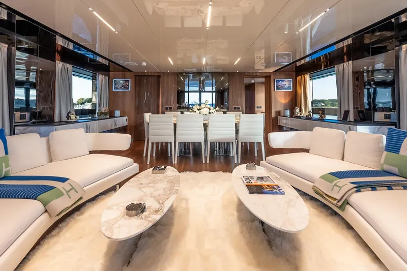 Neverland Yacht Photos Pics Luxurious interior of 2020 Sanlorenzo 44 Alloy yacht with elegant seating and dining area.