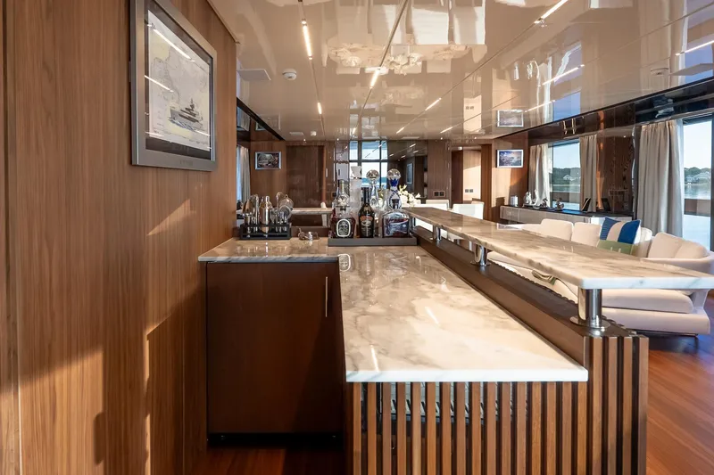 Neverland Yacht Photos Pics Luxurious interior of 2020 Sanlorenzo 44 Alloy yacht with elegant bar and seating area.