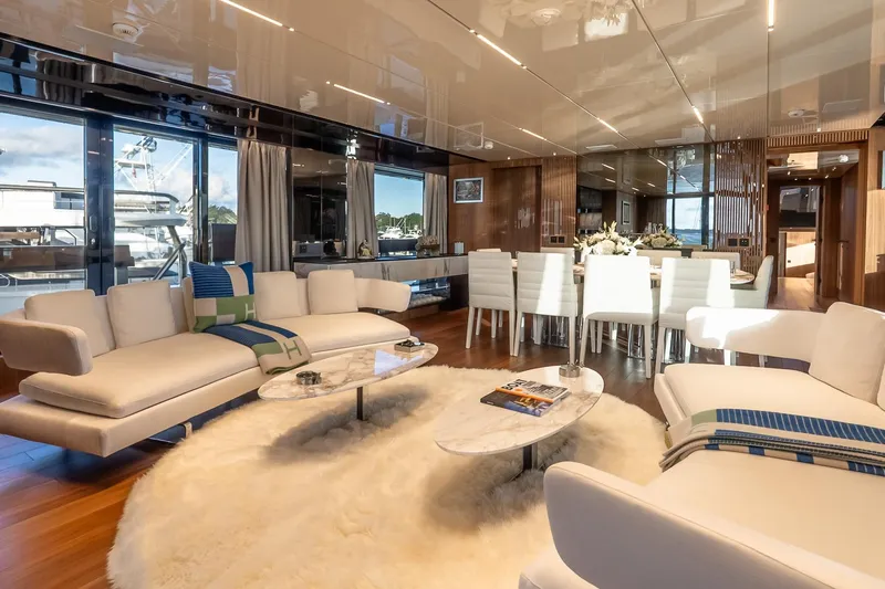 Neverland Yacht Photos Pics Luxurious interior of 2020 Sanlorenzo 44 Alloy yacht with elegant seating and dining area.