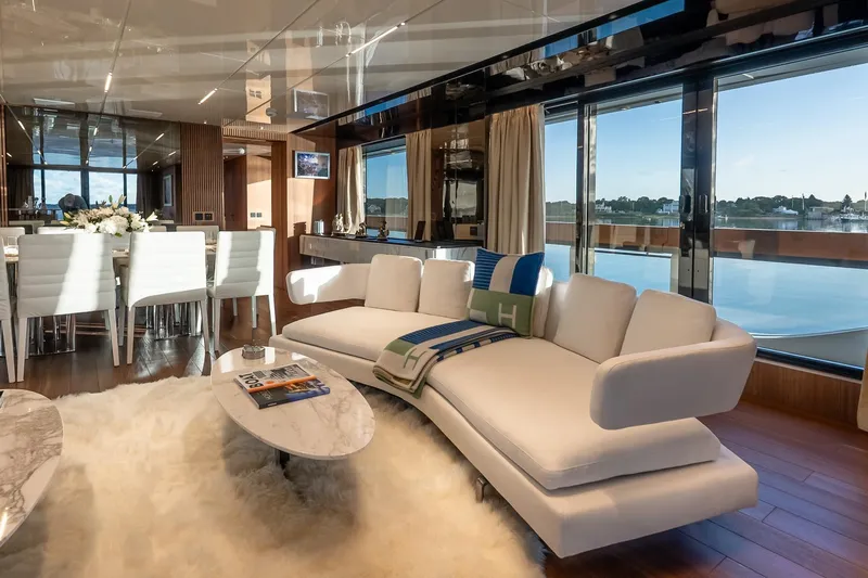 Neverland Yacht Photos Pics Luxurious interior of 2020 Sanlorenzo 44 Alloy yacht with elegant seating and dining area.