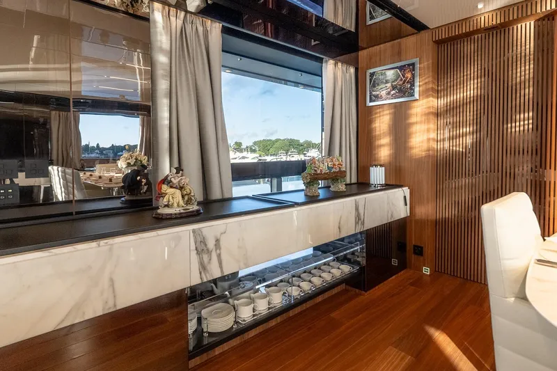 Neverland Yacht Photos Pics Luxurious interior of 2020 Sanlorenzo 44 Alloy yacht with elegant decor and scenic window view.