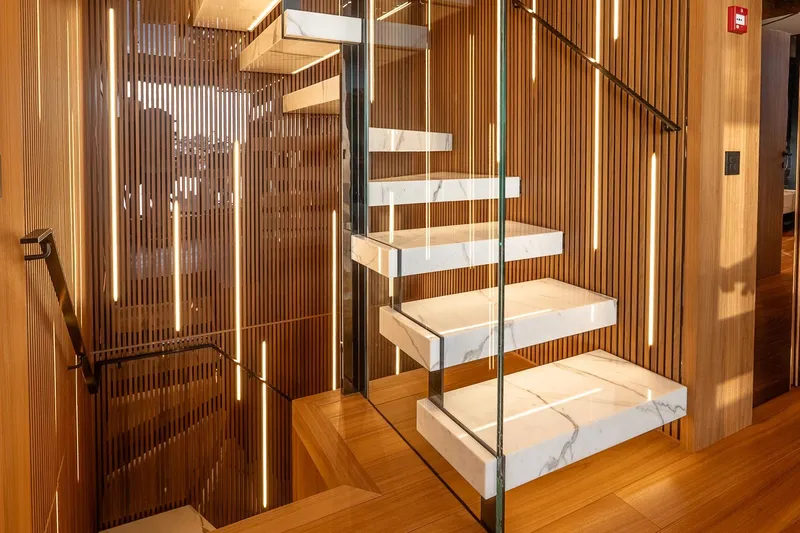Neverland Yacht Photos Pics Modern staircase with marble steps and wooden paneling on Sanlorenzo 44 Alloy yacht, 2020.