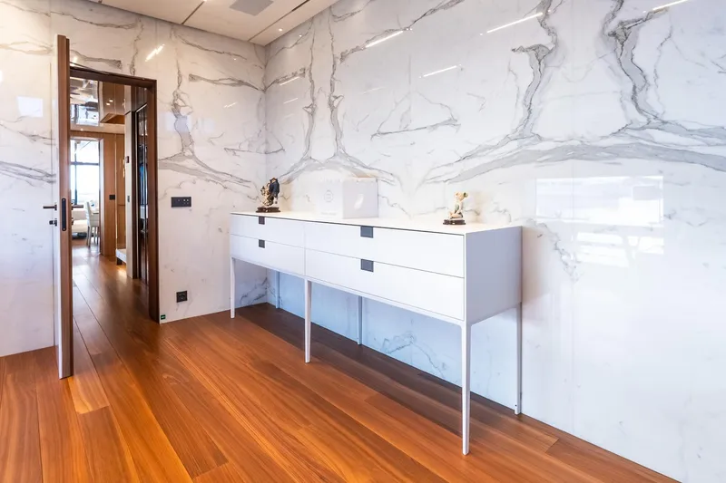 Neverland Yacht Photos Pics Luxurious interior of 2020 Sanlorenzo 44 Alloy yacht with marble walls and wooden flooring.