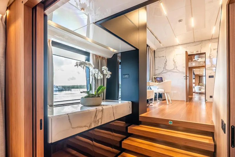 Neverland Yacht Photos Pics Luxurious interior of 2020 Sanlorenzo 44 Alloy yacht with elegant wood and marble finishes.