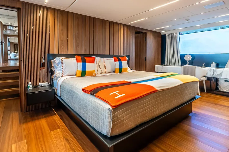 Neverland Yacht Photos Pics Luxurious bedroom interior on 2020 Sanlorenzo 44 Alloy yacht with modern design and vibrant decor.
