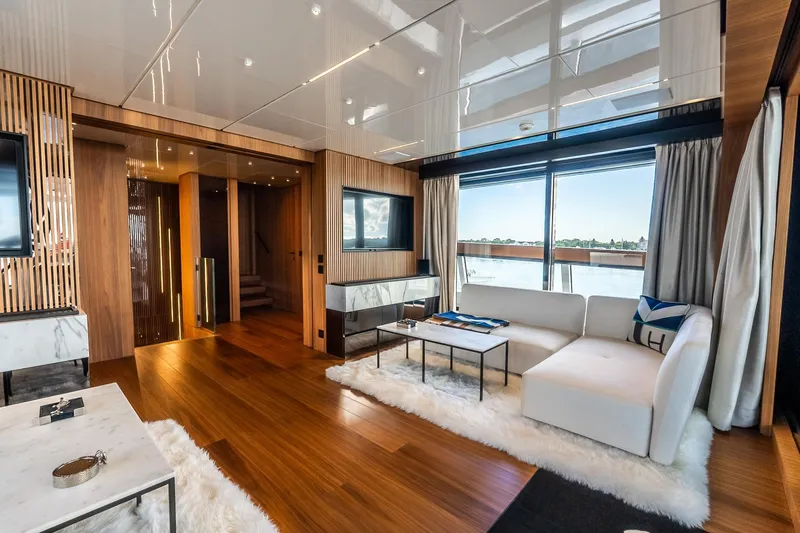 Neverland Yacht Photos Pics Luxurious interior of 2020 Sanlorenzo 44 Alloy yacht with modern decor and large windows.