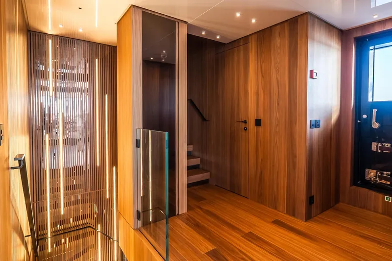 Neverland Yacht Photos Pics Luxurious interior of 2020 Sanlorenzo 44 Alloy yacht with elegant wood paneling and modern design.