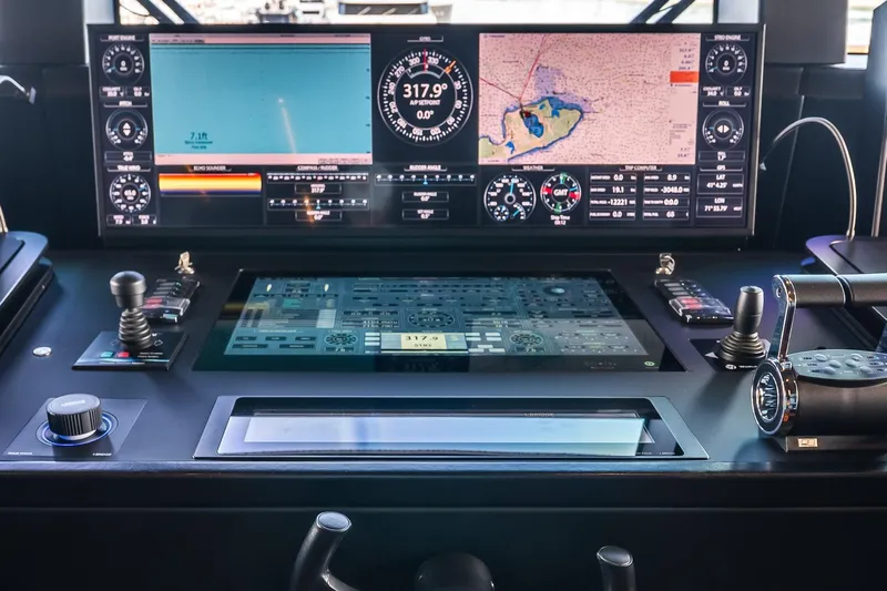 Neverland Yacht Photos Pics Control panel of a 2020 Sanlorenzo 44 Alloy yacht, featuring advanced navigation displays.