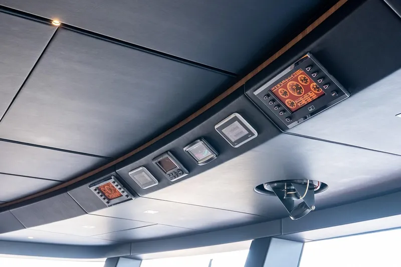 Neverland Yacht Photos Pics Control panel on 2020 Sanlorenzo 44 Alloy yacht ceiling, featuring modern navigation instruments.