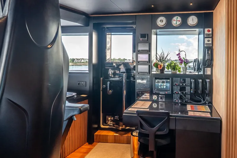 Neverland Yacht Photos Pics Interior of 2020 Sanlorenzo 44 Alloy yacht, featuring modern control panel and seating.