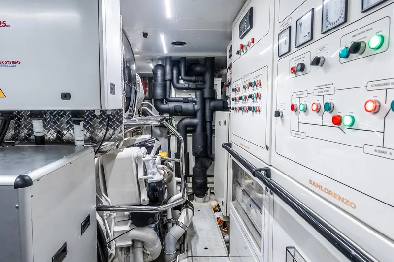 Neverland Yacht Photos Pics Engine room of 2020 Sanlorenzo 44 Alloy yacht with control panels and machinery.