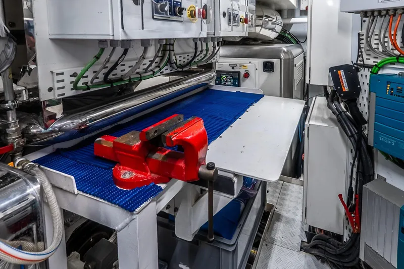 Neverland Yacht Photos Pics Engine room of 2020 Sanlorenzo 44 Alloy yacht with red vise and control panels.