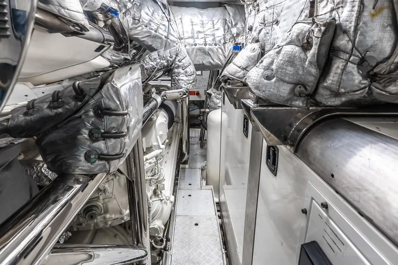 Neverland Yacht Photos Pics Engine room of 2020 Sanlorenzo 44 Alloy yacht, featuring insulated components and metallic surfaces.