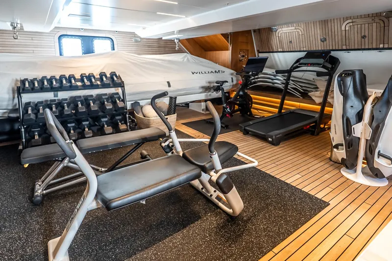 Neverland Yacht Photos Pics Luxury yacht Sanlorenzo 44 Alloy 2020 gym with exercise equipment and weights.