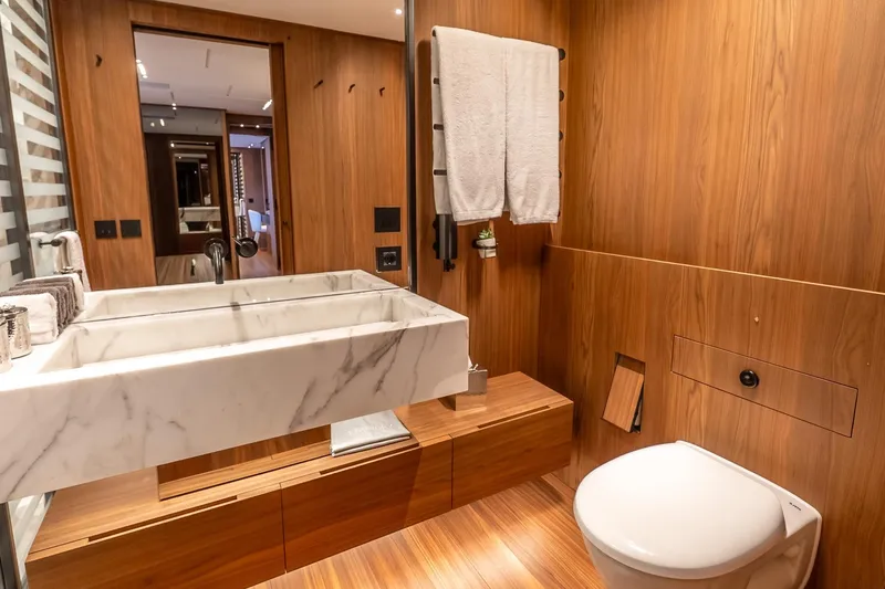 Neverland Yacht Photos Pics Luxurious bathroom on 2020 Sanlorenzo 44 Alloy yacht with wood paneling and marble sink.