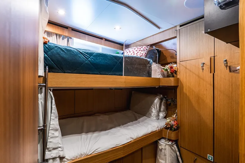 Neverland Yacht Photos Pics Cozy bunk beds in 2020 Sanlorenzo 44 Alloy yacht cabin with wooden interior.