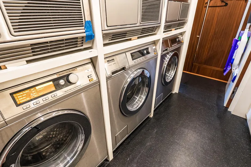 Neverland Yacht Photos Pics Laundry room with modern Miele appliances on Sanlorenzo 44 Alloy yacht, 2020 model.