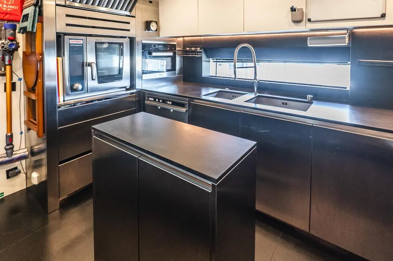 Neverland Yacht Photos Pics Modern kitchen in 2020 Sanlorenzo 44 Alloy yacht with sleek stainless steel appliances.