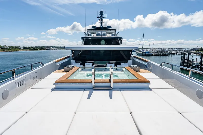 Neverland Yacht Photos Pics Luxurious 2020 Sanlorenzo 44 Alloy yacht with deck jacuzzi and scenic harbor view.