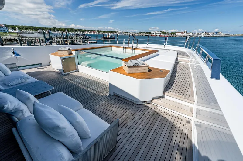 Neverland Yacht Photos Pics Luxurious Sanlorenzo 44 Alloy yacht deck with pool, 2020 model, docked by the sea.